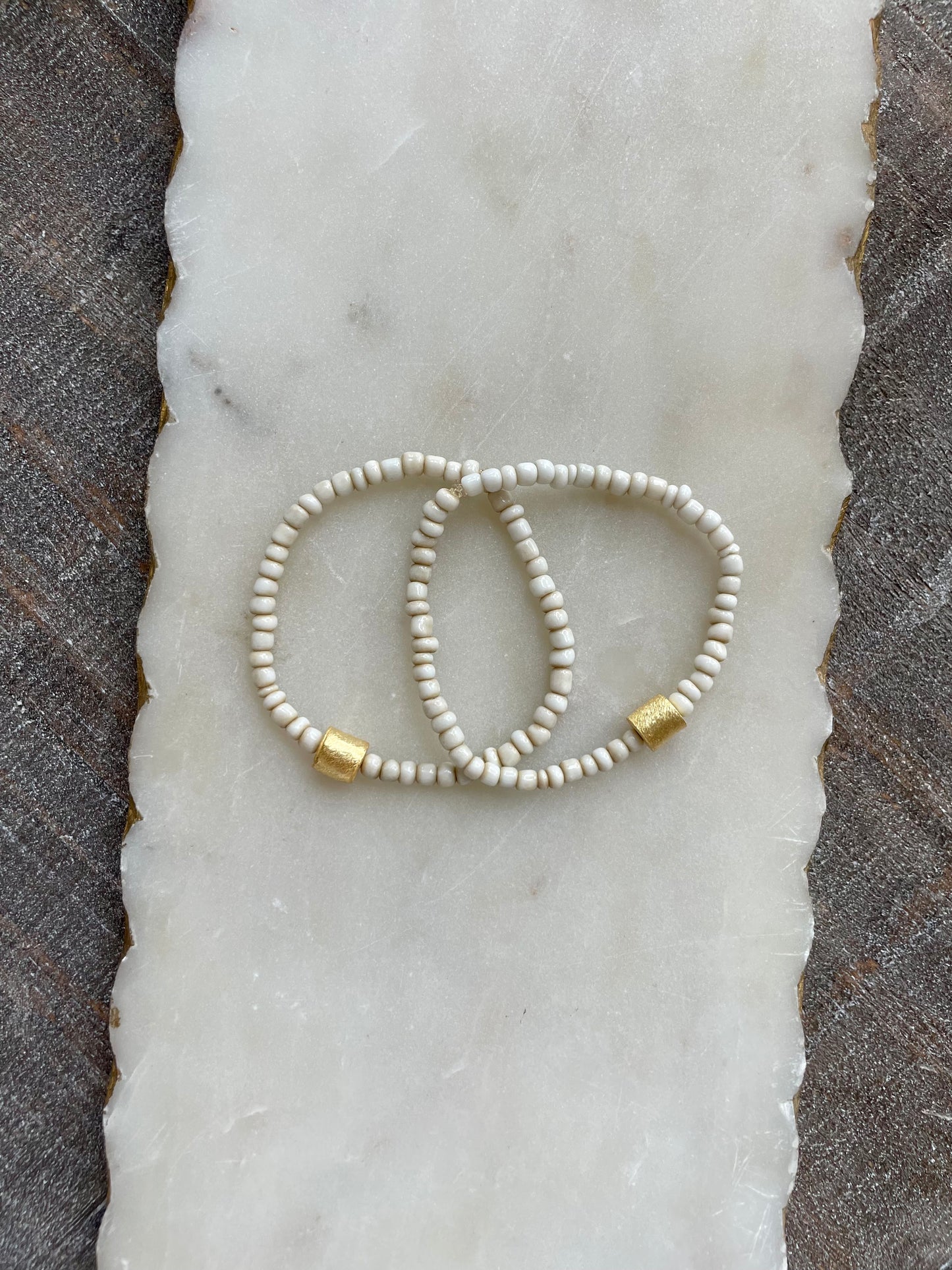 Small cream beaded bracelet with gold accent