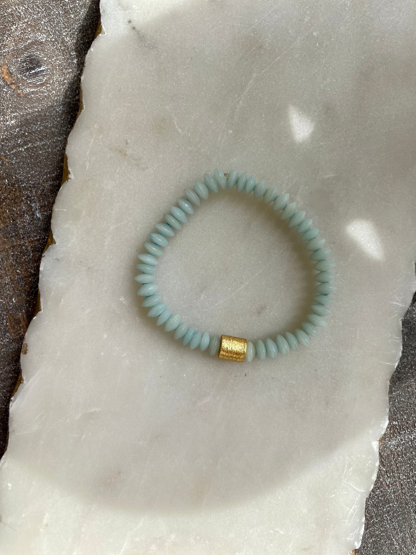 Light blue bracelet with gold accent