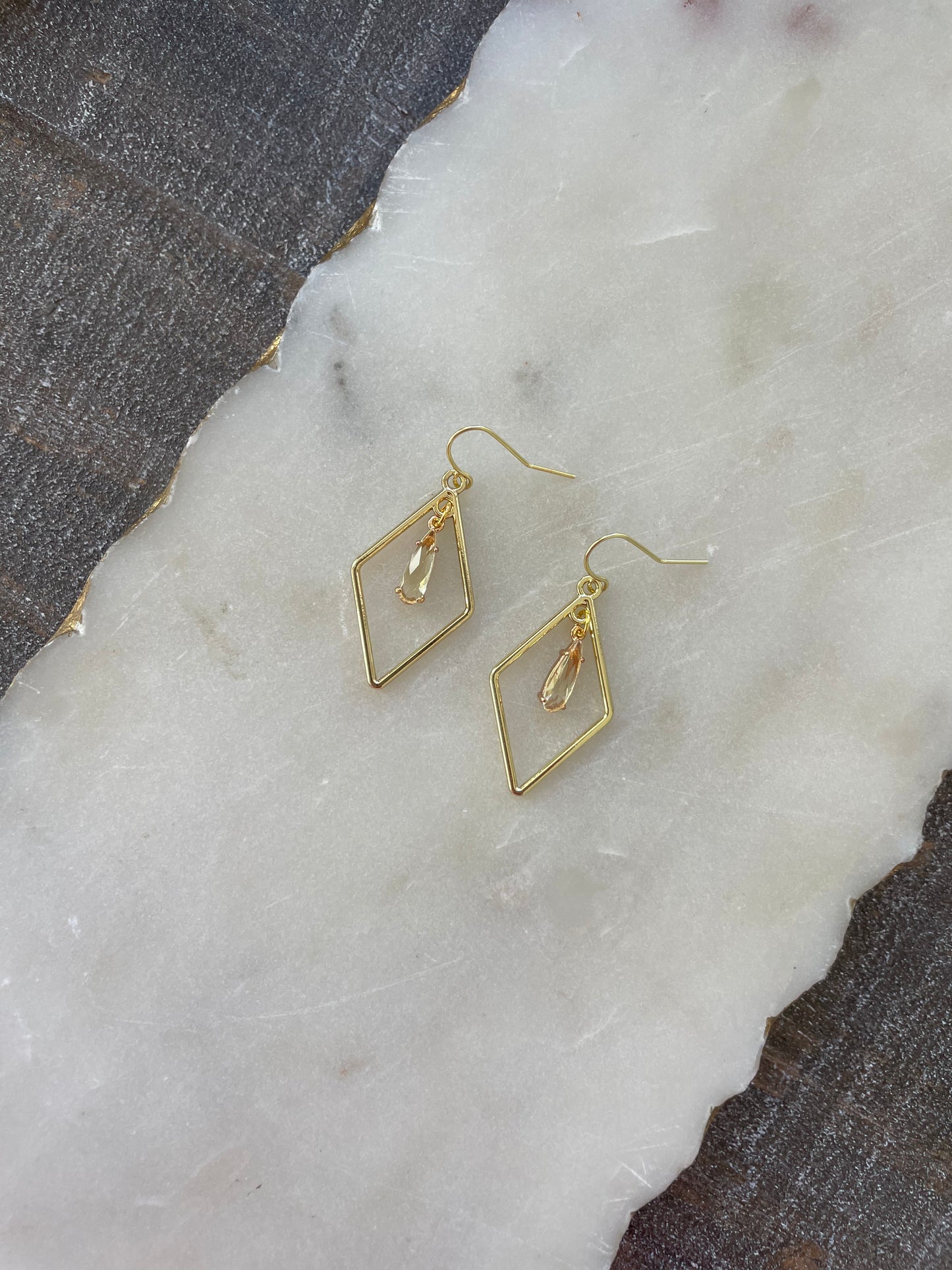 Gold earrings with small stone