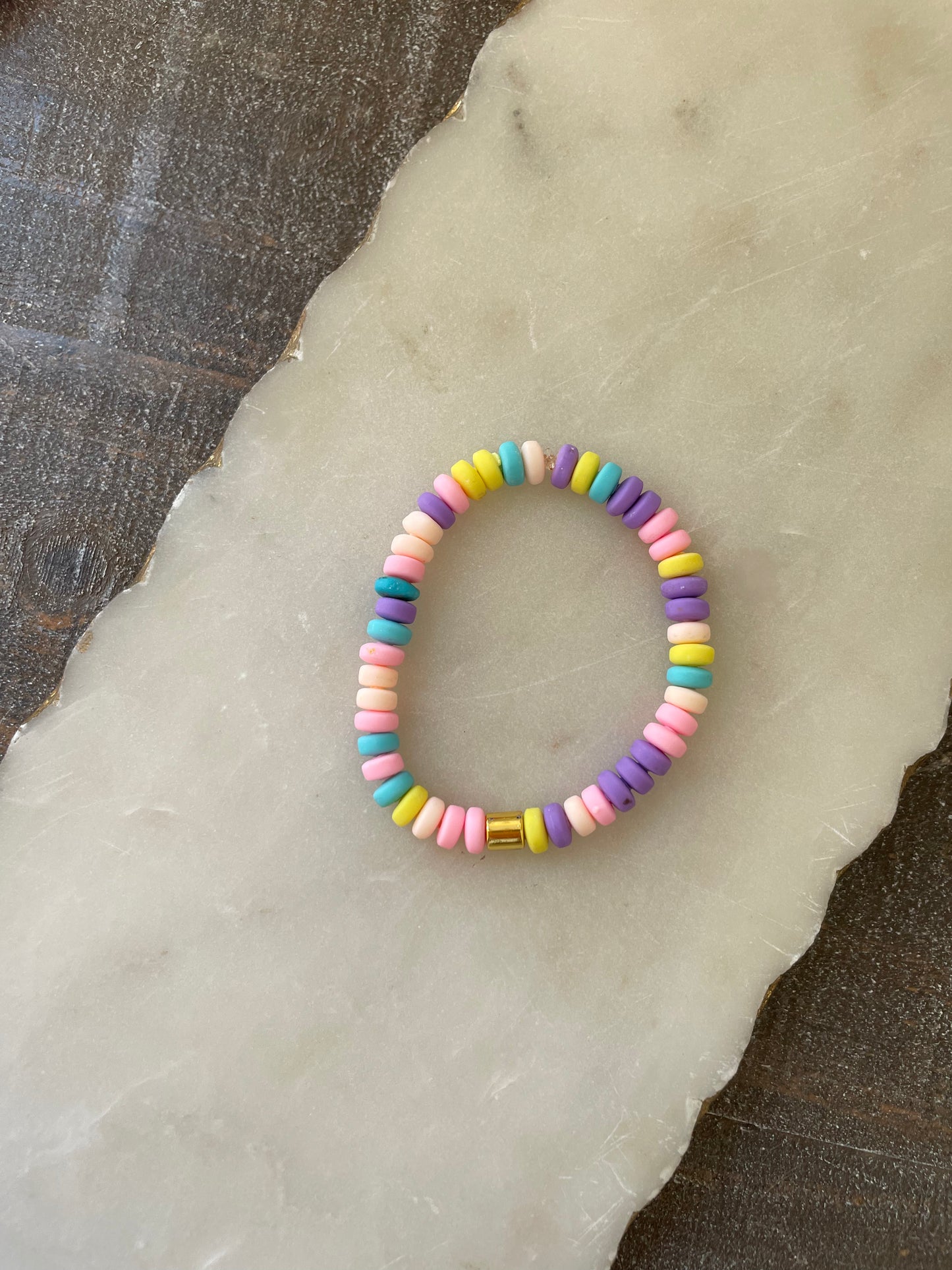 Colorful beaded bracelets with gold accents