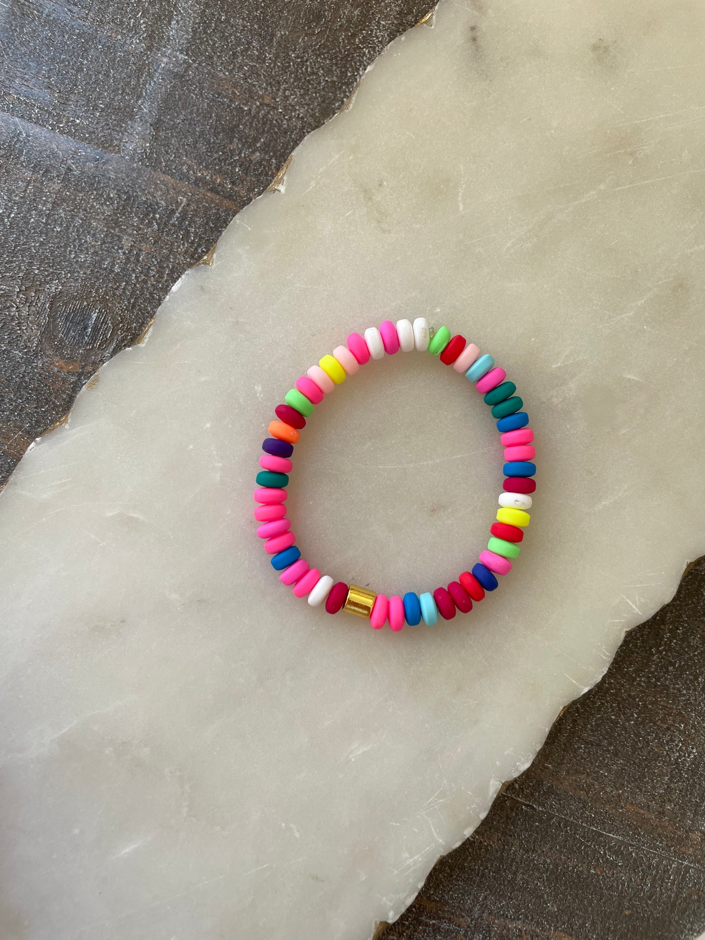 Colorful beaded bracelets with gold accents