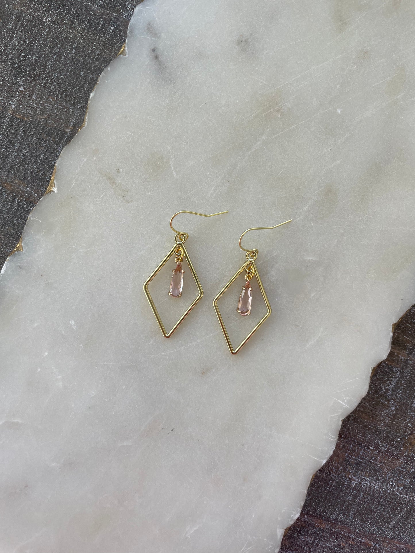 Gold earrings with small stone