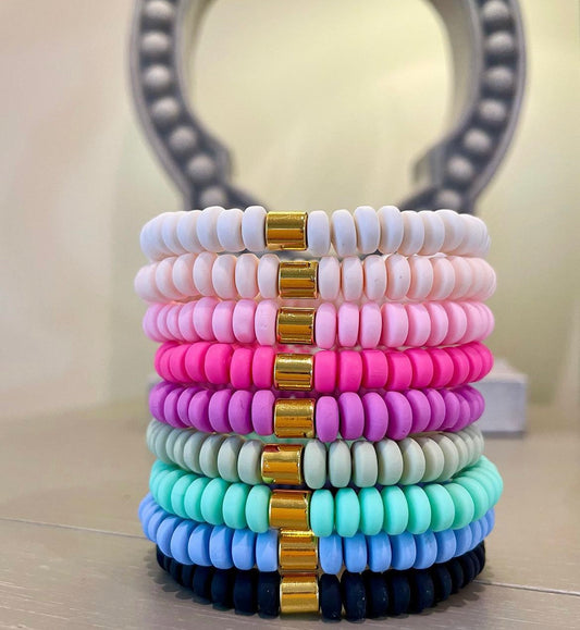 Colorful beaded bracelets with gold accents
