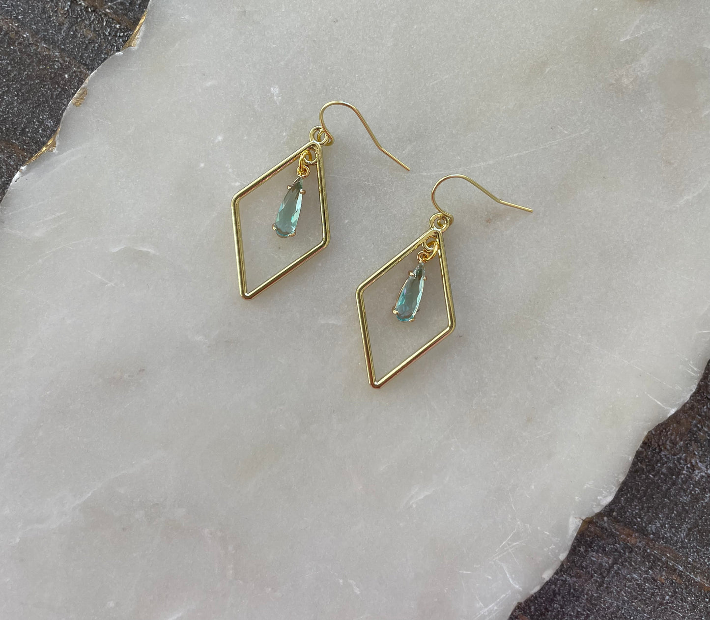 Gold earrings with small stone